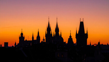 Obraz premium Cityscape Silhouette Background with Dramatic Sunset Behind Historic Gothic Church 