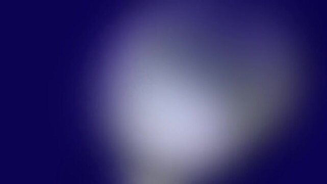 Blurry white light on dark background.