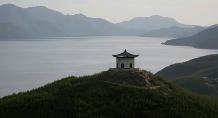Serene Pagoda Overlooking a Vast Lake Nestled Among Misty Mountains