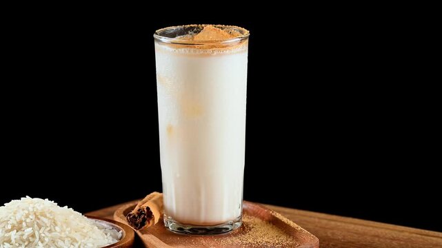 Rice horchata with cinnamon, a concept of authentic Mexican cuisine and traditional drinks, the drink is rotating on a rotating table