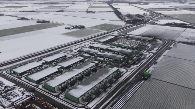 Aerial winter view of a large data computing center in Middenmeer, The Netherlands, representing digital infrastructure powering cloud services and artificial intelligence.