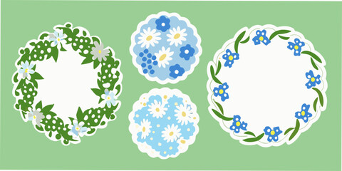 three circular floral wreaths with white outlines and blue and white flowers © Rakesh
