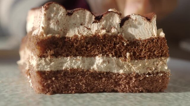 Enjoying dessert with layers of cake and cream