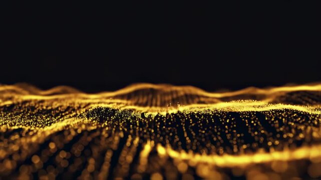 Abstract, glowing, golden particles form a wave-like pattern, blurred and set against dark background