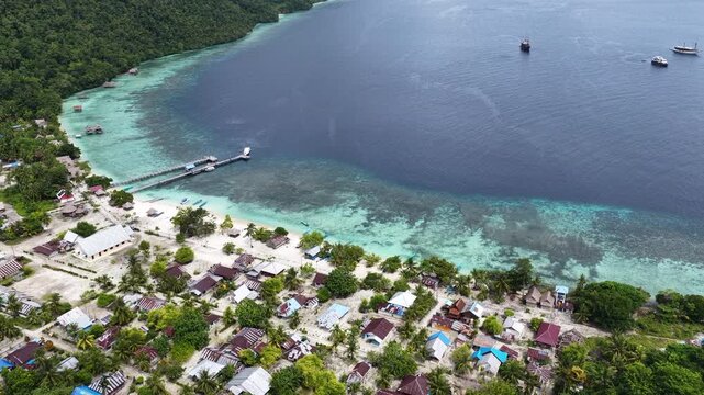 On the island of Mansuar, the small, quaint village of Sauwandarek looks out upon the Dampier Strait in Raja Ampat, Indonesia. 