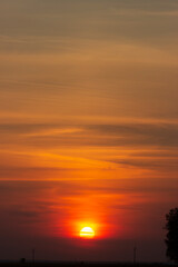 Fototapeta premium Sunset against a backdrop of clouds close to the horizon on planet Earth