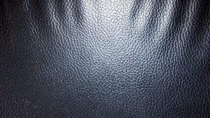 Leather with black relief and backlit with light from the side