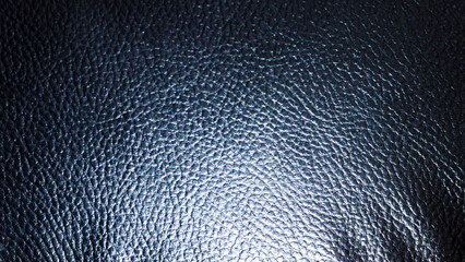 Leather with black relief and backlit with light from the side