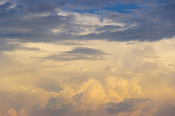 Sky with thick clouds in the evening light at sunset
