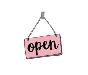 A pink rectangular sign with "open" in cursive lettering, hanging from a wire on a black background