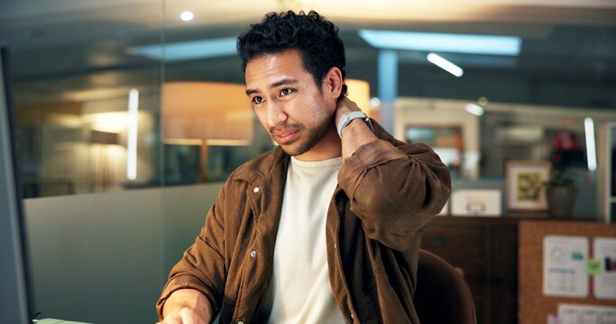 Computer, business man and neck pain in office from poor posture, deadline pressure or discomfort. Night, employee and tech with muscle tension at desk from project burnout, fatigue and joint strain