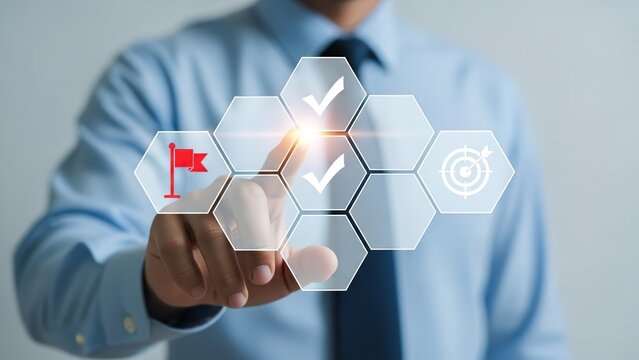 A person in business attire interacting with a virtual screen displaying goal-setting and achievement icons.