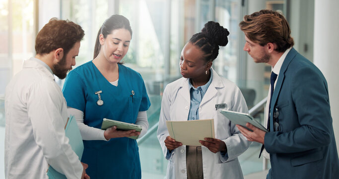 Businessman, doctors and nurse with tablet in clinic for medical admin, patient system or feedback. People, healthcare team and HR manager with tech for insurance claim, staff policy and compliance