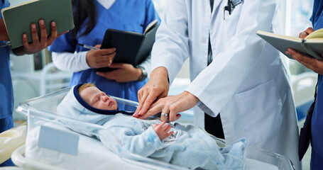 Hands, nurses and doctor with CPR training on baby doll for medical simulation, life saving or...