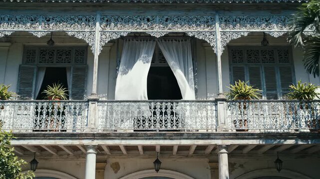 Ornate Balcony With Curtains Blowing in Breeze, Old Colonial Architecture