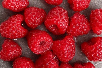 Freshly Picked Raspberries. Close-Up of Vibrant Red Berries with Drops of Water for Healthy Eating.