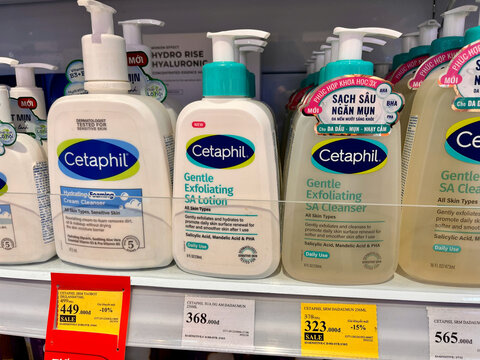 Da nang, Vietnam - January, 16, 2026: Various bottles of Cetaphil skincare products displayed on a store shelf. The products include lotion and exfoliating gel