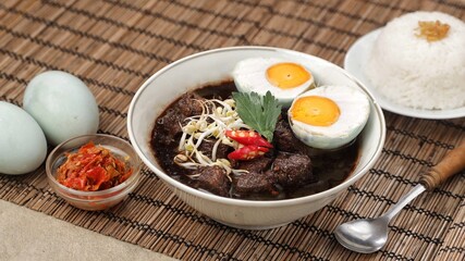 Rawon is a typical Indonesian dish originating from Ponorogo, East Java, which is a black meat soup with a mixture of special spices using kluwek.