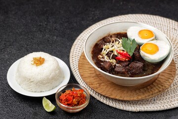 Rawon is a typical Indonesian dish originating from Ponorogo, East Java, which is a black meat soup with a mixture of special spices using kluwek.