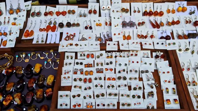 Fancy Jewelry Items - Earrings And Bracelets, For Sale At A Market In Cesis, Latvia. - pan shot