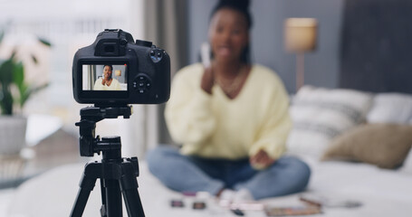 Influencer, live streaming and woman with camera in home for product review, beauty tutorial and feedback. Content creator, social media and person in bedroom with cosmetics for testing on broadcast
