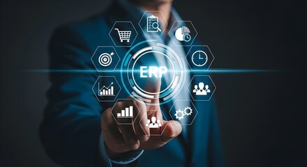 Close-up of a businessman interacting with an ERP enterprise resource planning interface on a dark background with various icons and graphs.