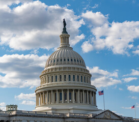 Obraz premium Washington DC landmark. Senate and House in Washington DC. Capitol dome. Historic Capitol by the national flag. Capitol dome as symbol of law. Washington monument architecture