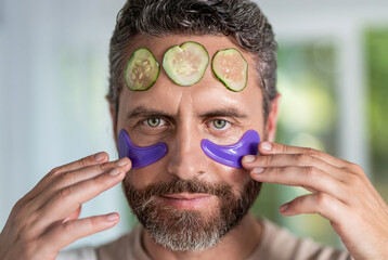 Vitamin collagen patches. Eye patch. Beauty man face with under eye collagen pads. Skin with moisturizing patches under eyes. Beauty skin cosmetology of man with patch. Man use eye patch