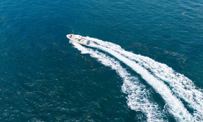 Motor yacht luxury vessel. Sea motor boat. Sea summer vacation. Aerial motorboat. Yacht boat tour. Luxury boat yachting. Motorboat sailing at sea. Luxury charter yacht in sea. Tropical getaway