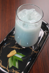 Cold blue butterfly pea milk with ginger and pandan