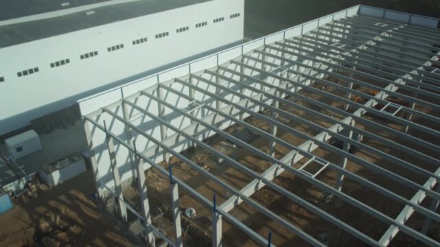 Industrial building framework, Assembly of large steel trusses near current facility underway rapidly