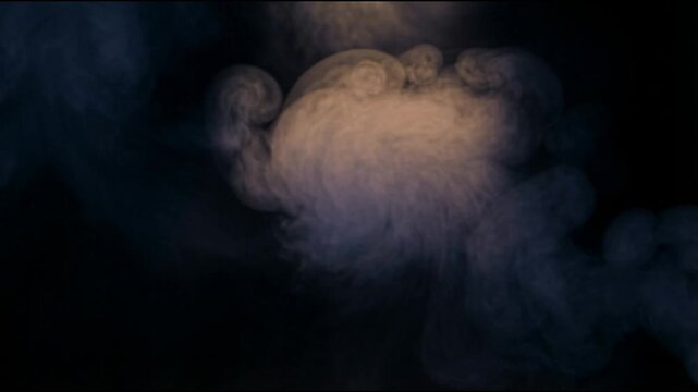 Dense blue gray smoke rolling slowly through a deep black background with soft swirling motion layered depth and a calm cinematic abstract atmosphere