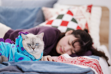 Cozy Winter Lifestyle Cat Resting While Woman Sleeps at Home