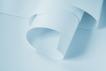 A folded sheet of paper in a cool blue tone.