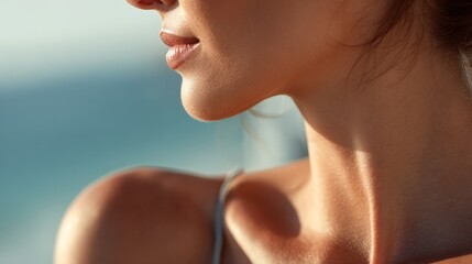 close-up of a womans shoulder sunbathing