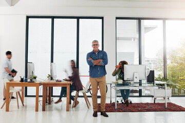 Fototapeta premium Portrait, arms crossed and man with smile in busy office, confident and entrepreneur of web design business. Professional, pride and manager of company in workplace, startup and agency development