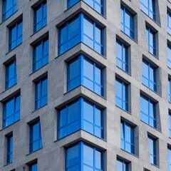 Fototapeta premium Modern Glass Facade of High-Rise Building