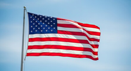 Obraz premium American Flag Waving Against Blue Sky