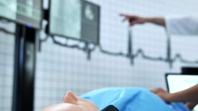 Medical student and instructor practicing on a simulation mannequin during training course