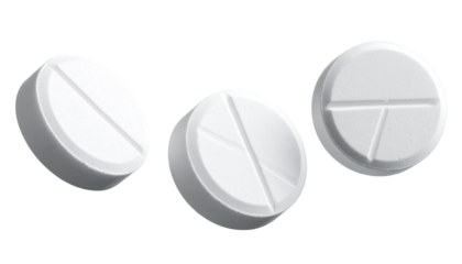 Closeup of round white prescription medicine tablets and antibiotic pills isolated on white background for pharmaceutical healthcare treatment and pain relief