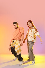 Obraz premium Couple of hip-hop dancers on light background