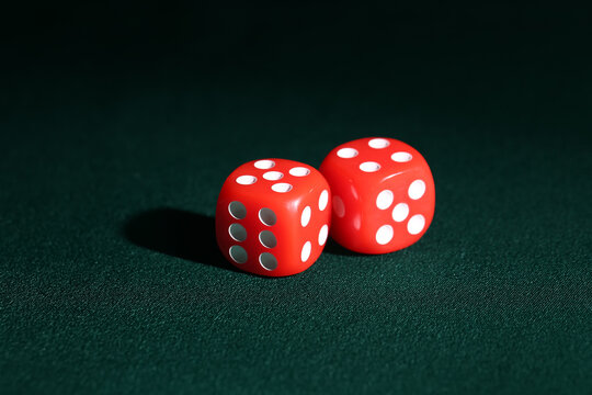 Red game dices on green background