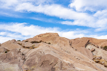 Fototapeta premium Vasquez Formation, Yellowish and reddish sandstone, conglomerate, and interbedded andesite-basalt. Sierra Pelona Ridge. Los Angeles County, California. Vasquez Rocks Natural Area and Nature Center. 