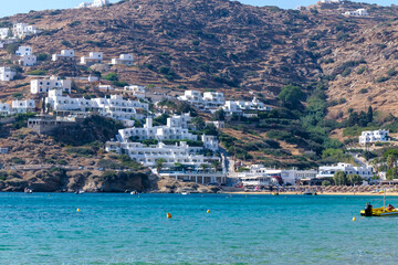 Panoramic view of various whitewashed hotels at the popular sandy beach of Mylopotas in Ios Greece
