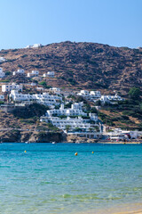 Panoramic view of various whitewashed hotels at the popular sandy beach of Mylopotas in Ios Greece