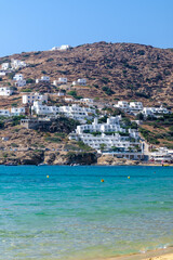 Panoramic view of various whitewashed hotels at the popular sandy beach of Mylopotas in Ios Greece
