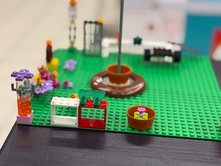 Naklejka premium Colorful lego garden scene with flowers and pots