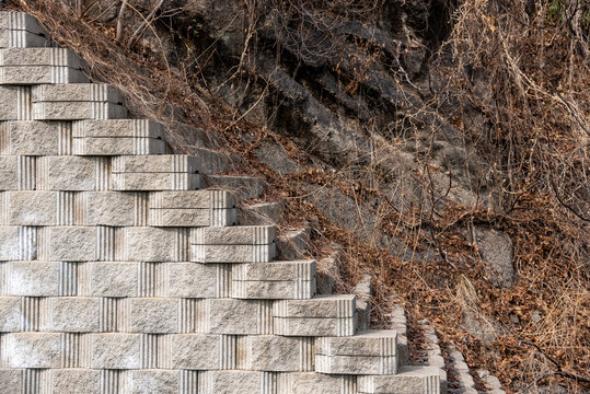 Geometric Stone Retaining Wall on Rocky Hillside