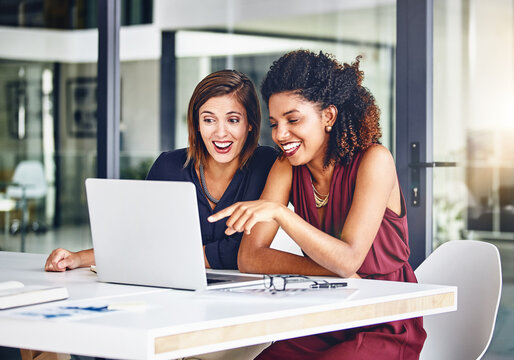 Office, laughing and business women on laptop for online website, internet and chatting on break. Corporate, teamwork and people on computer talking for financial report, conversation and planning