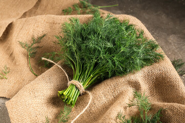 Bunch of fresh green dill on grey background, closeup © Pixel-Shot